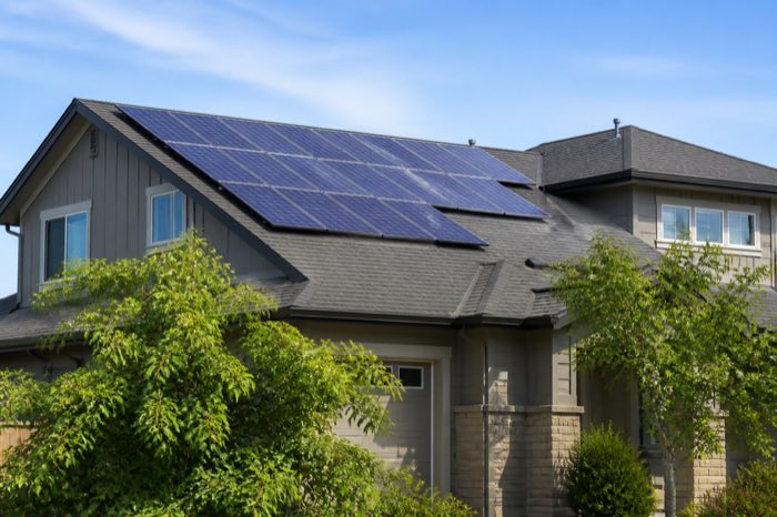 Solar panels installed on a residential roof in bright daylight